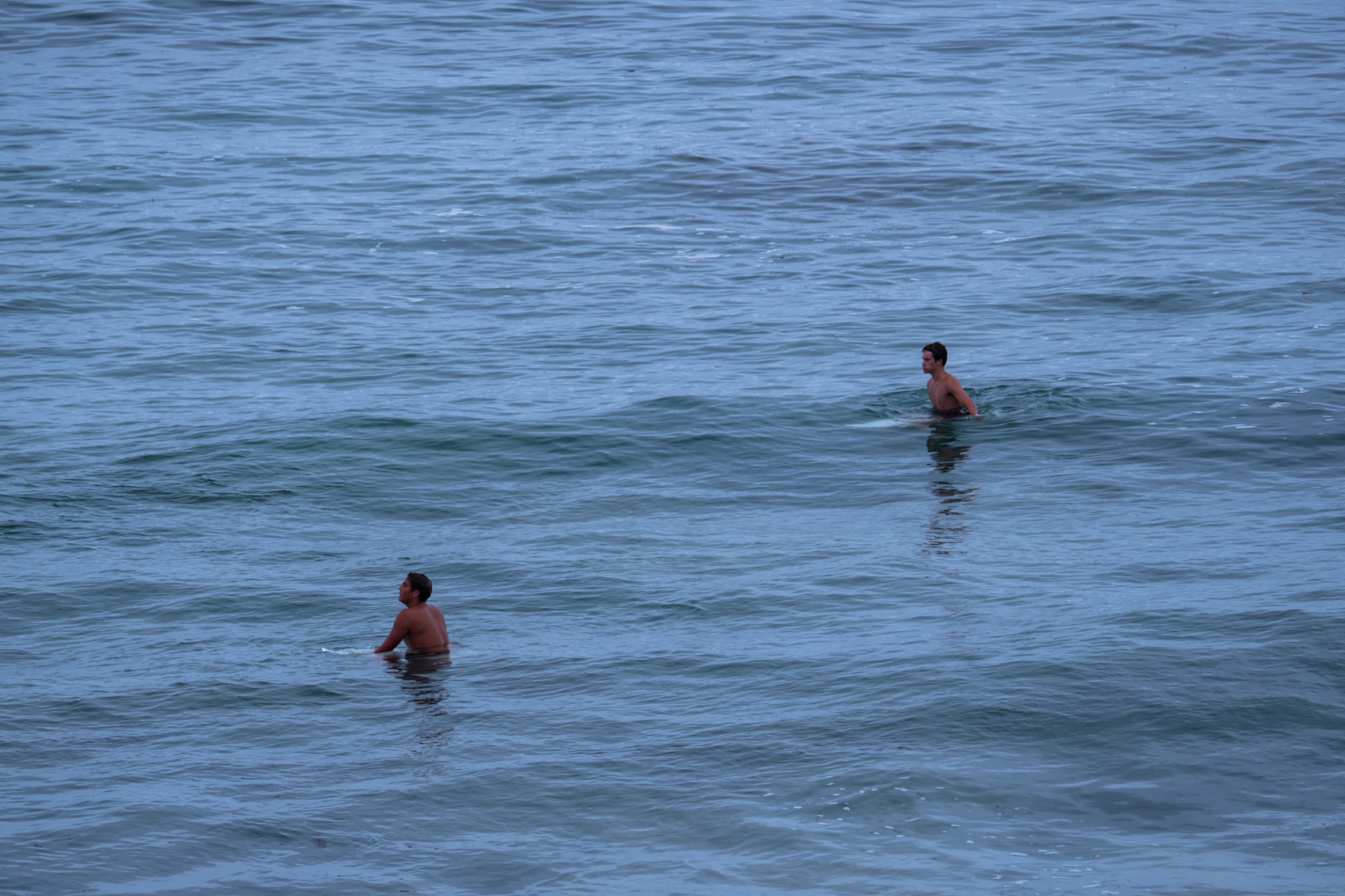 surfers waiting in the lineup